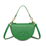 A small semicircular leather crossbody bag in a solid color with a stitched leather logo in the same color