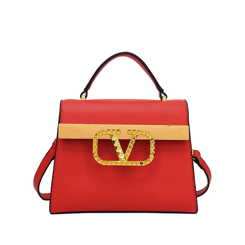 Solid color handbag with gold V logo