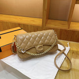 Solid color leather handbag with a gold chain and additional shoulder strap