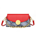 Denim print leather crossbody bag with full color flap and round gold button closure with short chain and shoulder strap
