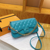 Solid color leather handbag with a gold chain and additional shoulder strap