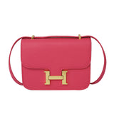 Square crossbody bag with gold button
