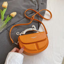A modern bag with a semi-circular shape in a solid color