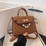 Solid color leather crossbody bag with an elegant button closure