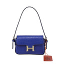Leather shoulder bag with black borders and H-shaped button closure