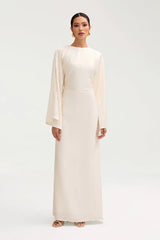 Long dress with long sleeves and a tie at the back to show off the beauty of the dress