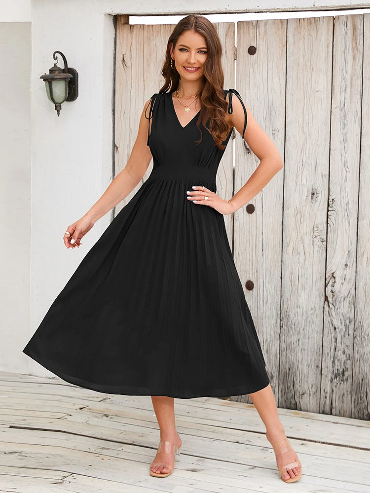Elegant solid color pleated dress, sleeveless, with shoulder straps and a V-neck