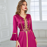 glabiya dress embroidered by gold details, in purple color with long frilly sleeves and a belt