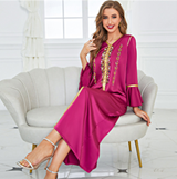 glabiya dress embroidered by gold details, in purple color with long frilly sleeves and a belt